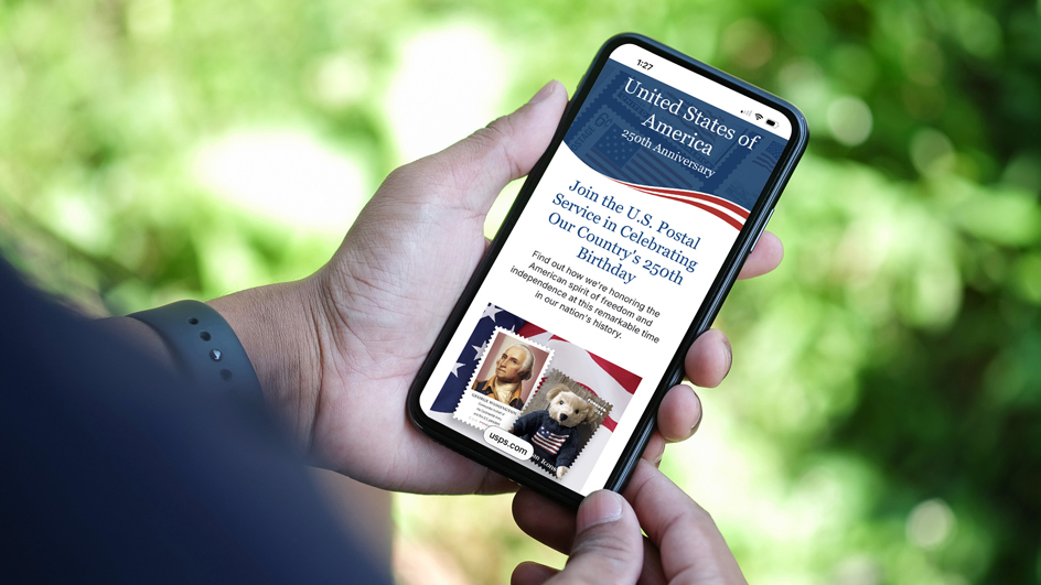 air of hands holding a cell phone that is displaying a USPS website