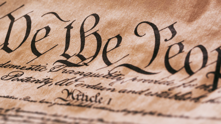 The Declaration of Independence resting on an American flag