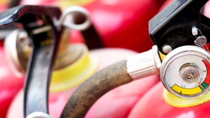 Group of red fire extinguishers