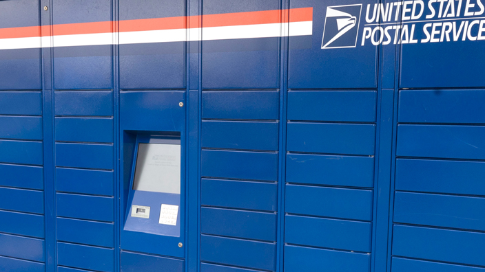 A bank of blue package lockers.