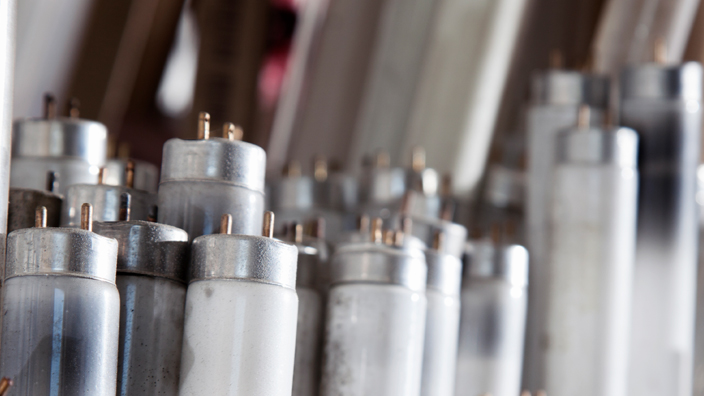 A group of used fluorescent light bulbs