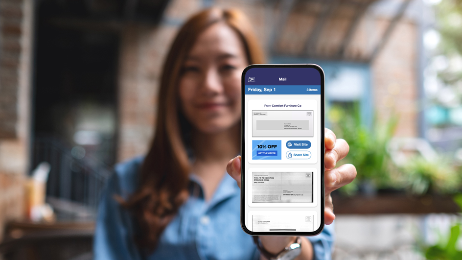 Woman holding up a mobile phone displaying the Informed Delivery Mobile app