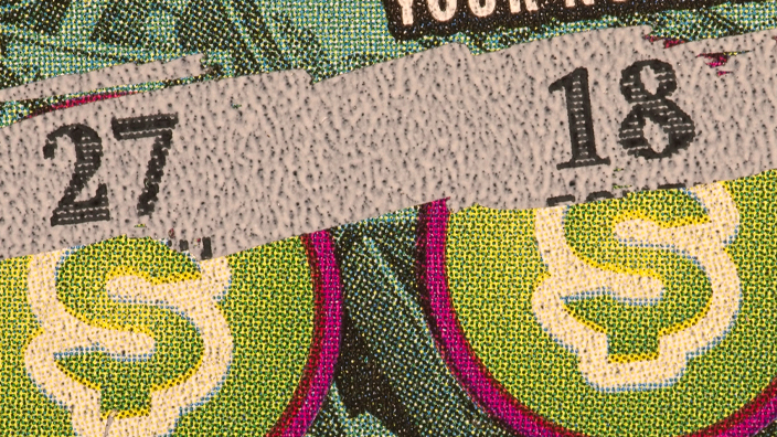 Scratched-off lottery ticket showing $10 winning prize