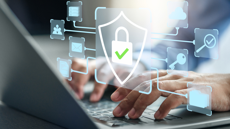 Man typing on a laptop with cybersecurity alert images