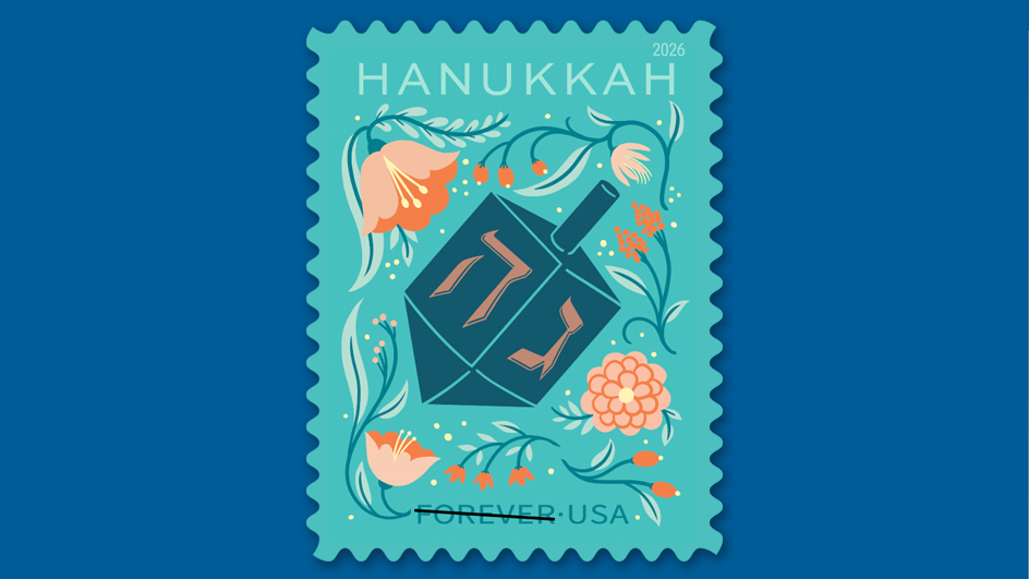 Hanukkah stamp with a dark blue dreidel and orange flowers on a turquoise background