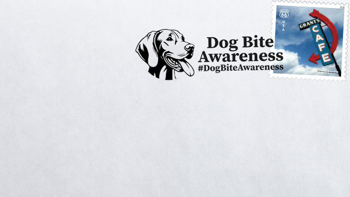 An envelope with a postmark featuring the image of a dog’s head reading “Dog Bite Awareness”