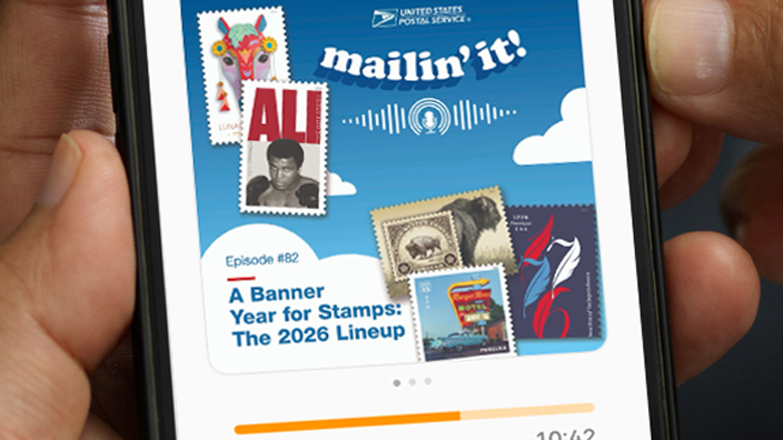 A pair of hands holding a cellphone displaying an episode of “Mailin’ It!”, the USPS podcast